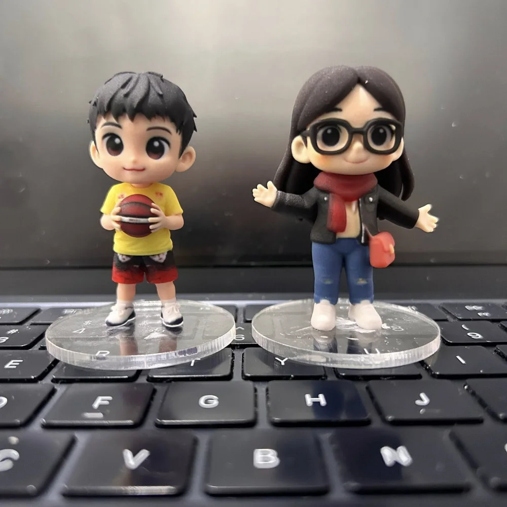A personalized basketball player and traveler Cuties figurine pair